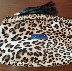 4 New in plastic Makeup Bags